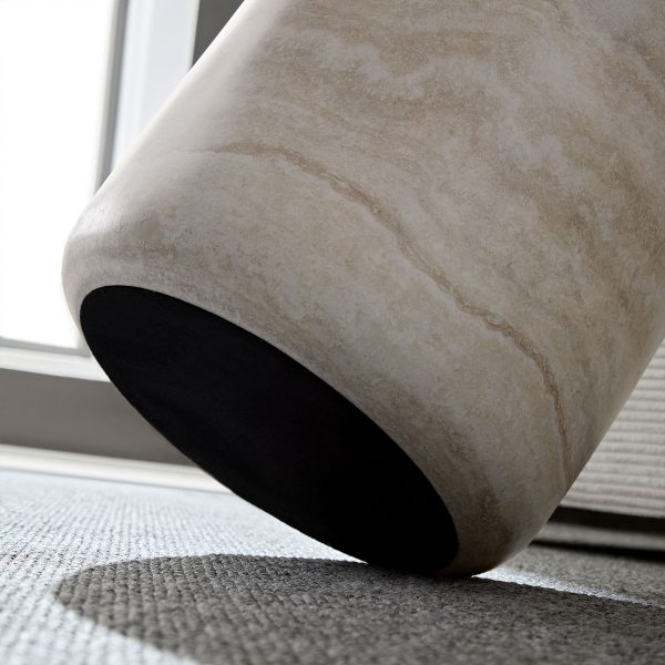 Close-up of the pre-installed protective pads on the base of the travertine cylinder side table