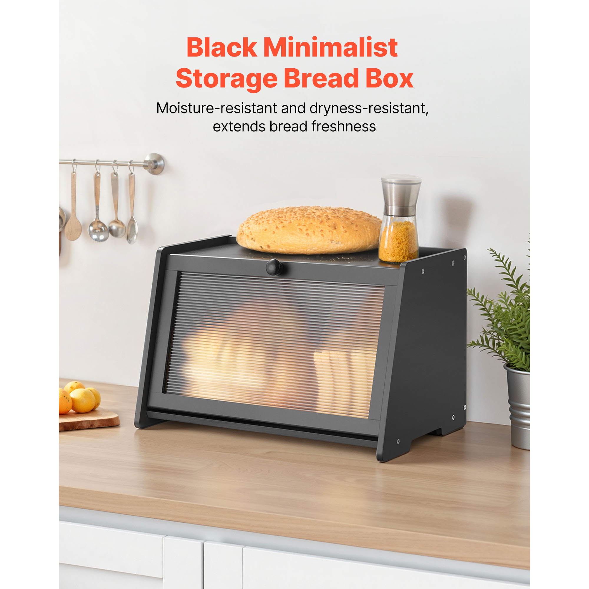 Black bamboo bread box with acrylic wavy door on a farmhouse kitchen counter, flat top holding fresh bread