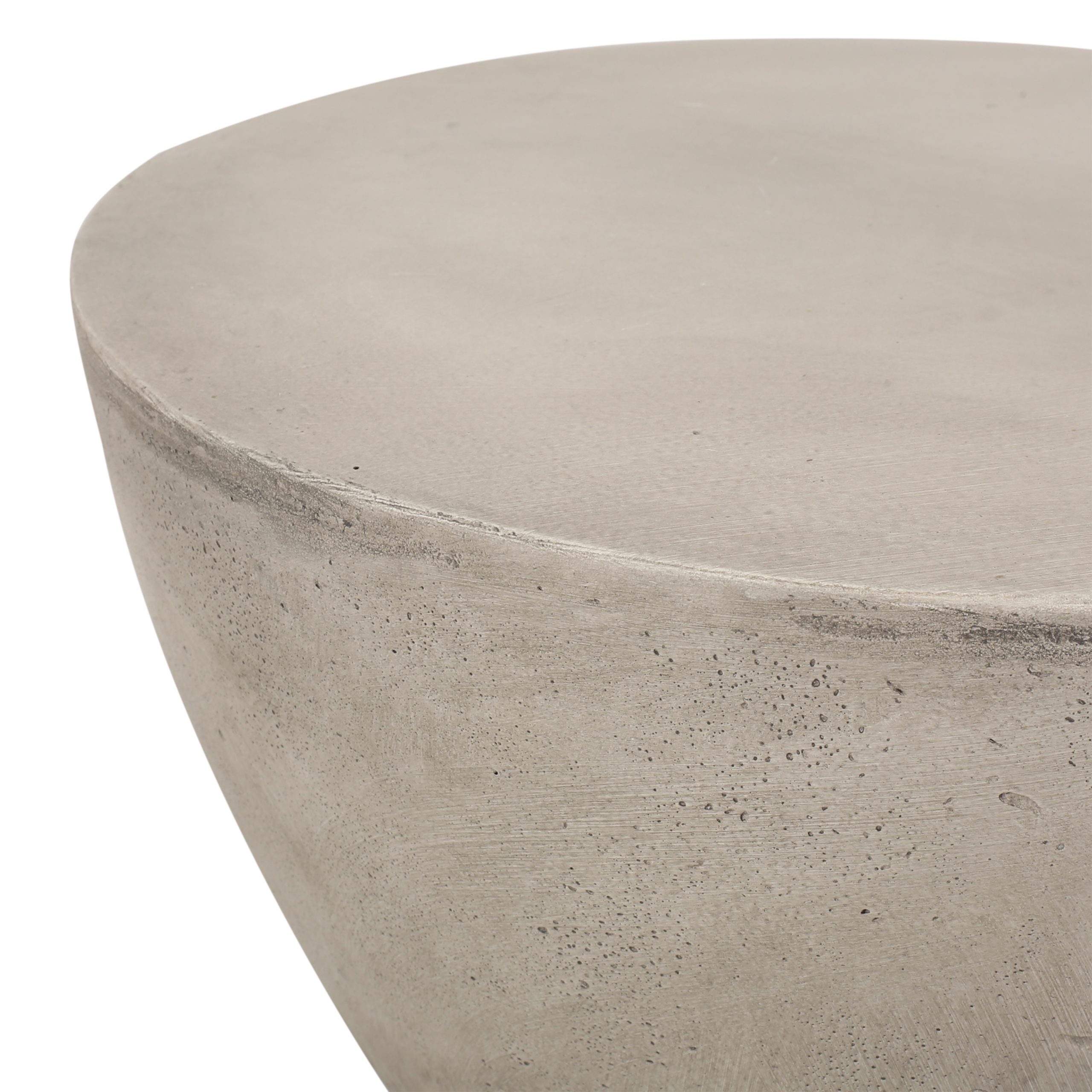 Close-up of the smooth matte concrete tabletop edge with speckled stone texture