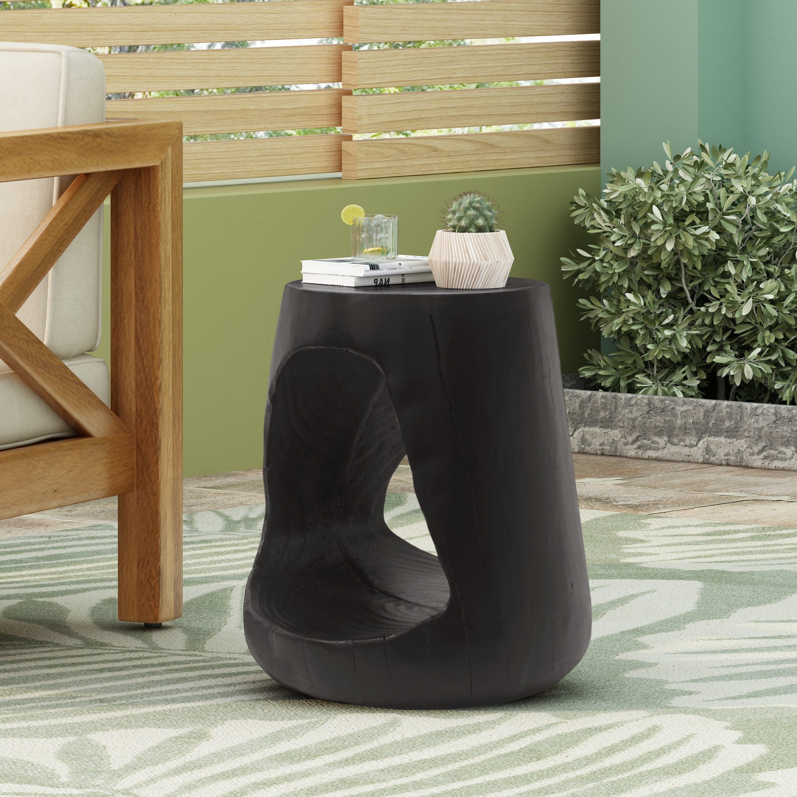 Orivane MGO hollow round side table with wood-grain finish styled beside a sofa