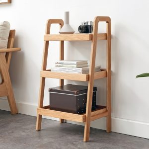 Orivane oak ladder shelf with three tiers in natural wood, styled with books and decor