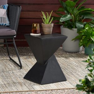 Weather-resistant black hourglass side table holding plants and drinks on a covered patio